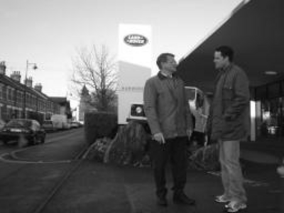 Cllr Hussey and James outside Webber Garage