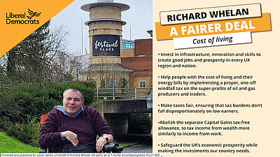 Richard Whelan in front of Festival place with a list of libdem policies on the cost of living